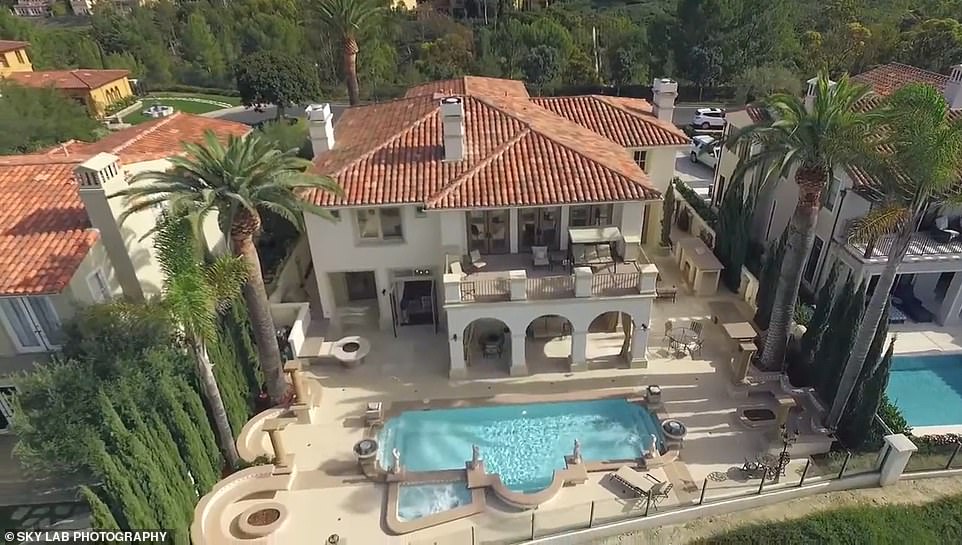 Intruders were met with gunfire Monday as they attempted to accost residents staying at the posh $7 million mansion in the gated community of Newport Coast.