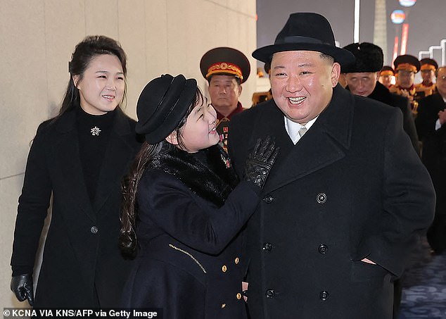 This photo taken on February 8, 2023 and published by North Korea's official Korean Central News Agency (KCNA) shows North Korean leader Kim Jong Un (right), his daughter Ju Ae (center) and his wife Ri Sol Ju (left) attending a military ceremony.  parade celebrating the 75th anniversary of the founding of the Korean People's Army