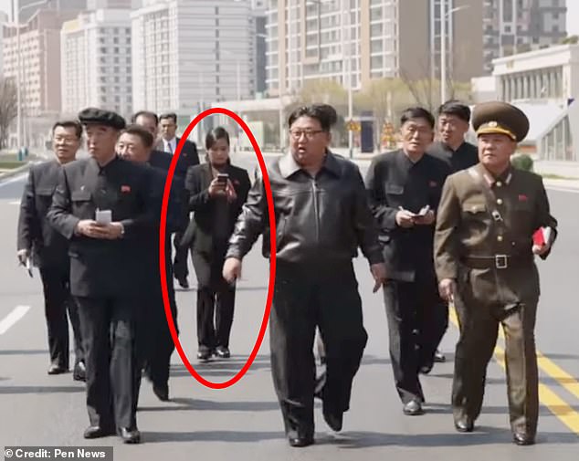 A North Korean pop star (circled) has been spotted with Kim Jong-un amid rumors that she is his secret love and gave birth to his beloved son.