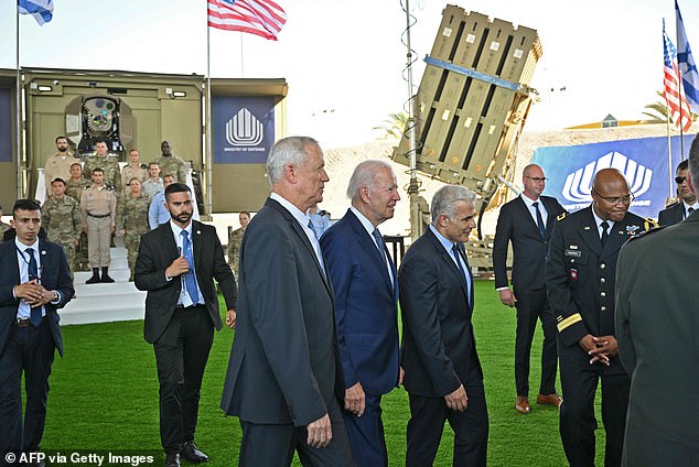 Israel's solution to the Iron Dome cost problem, the Iron Beam laser, is currently in development. Above, President Joe Biden walks with Israeli Defense Minister Benny Gantz (to Biden's left) in front of an Iron Beam prototype (left) and an Iron Dome battery (right) in July 2022.