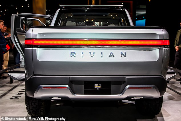 The Rivian R1T pickup truck (pictured) has suffered a $3,100 price cut as global electric vehicle sales fall and companies rush to introduce cost-cutting measures.