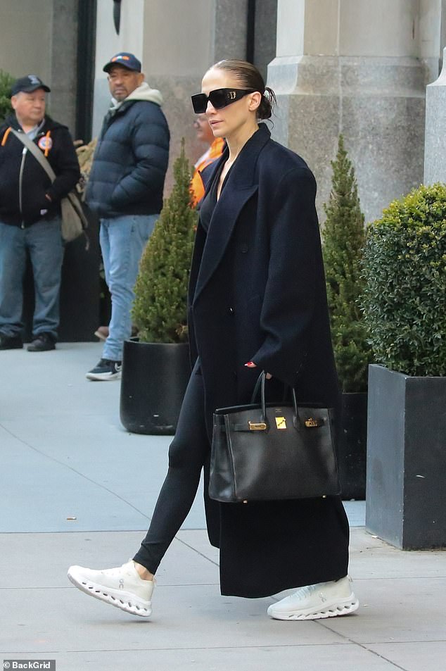 Leaving her luxury duplex, located in Whitman, near Madison Square Park, the superstar, 54, dressed in a plain black shirt, matching leggings and a pair of oversized Dior sunglasses.