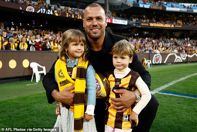 Lance Franklin took a lap of honor with his children Tullulah and Rocky on Sunday
