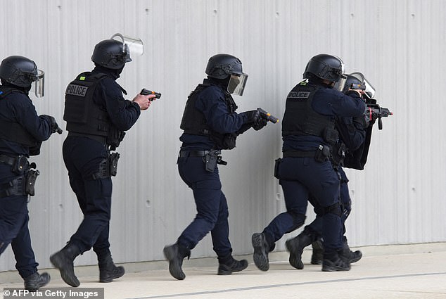 The file photo shows French police forces, including the Investigation and Intervention Brigade, who raided the house in Gennevilliers, participating in anti-terrorism exercises on March 27.