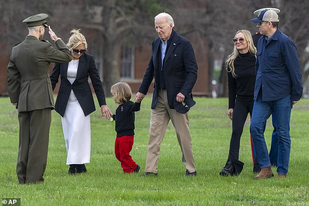 The Biden family was all smiles as the president and first lady emerged from Marine One holding hands with their grandson Beau Biden.