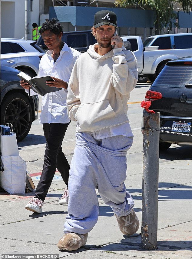 Justin Bieber turned heads when he stepped out in a pair of cozy $3,600 (£2,895) beige Louis Vuitton slippers and low-rise track pants in West Hollywood on Wednesday.