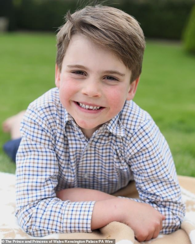 Prince Louis photographed by the Princess of Wales on his sixth birthday.  The image shows the royal lying on a picnic blanket in the grounds of the Windsor estate.