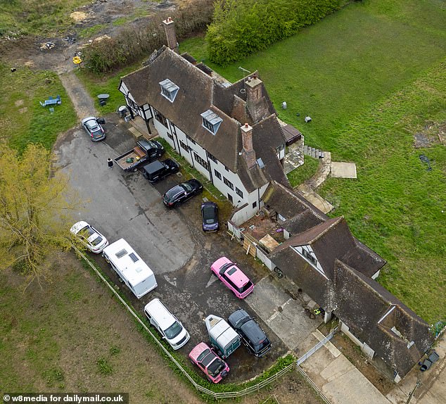 Katie Price's Mucky Mansion is still surrounded by her massive car collection, just days after she skipped a court hearing on Friday because she decided to go on vacation with her boyfriend JJ Slater.