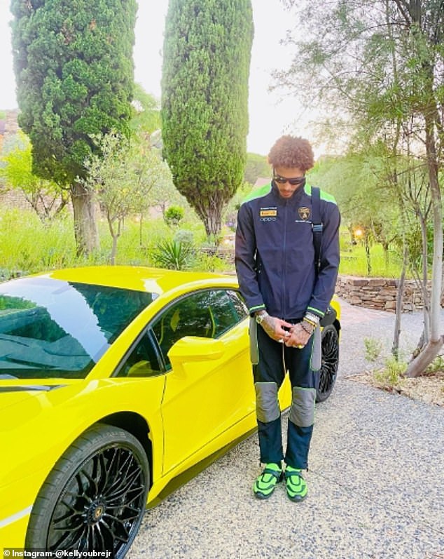 Kelly Oubre is seen posing with a yellow Lamborghini, not the one she crashed this week