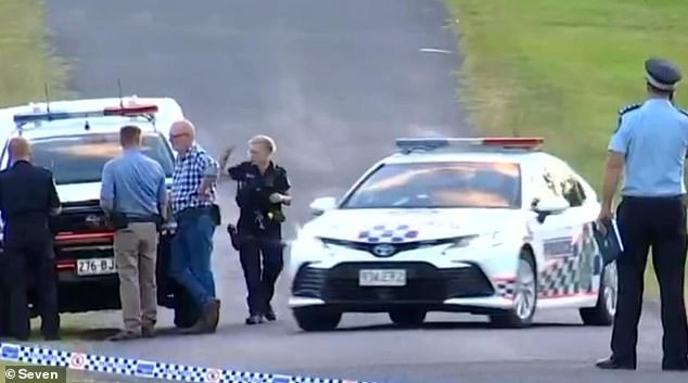 A small community in central Queensland has been rocked by a fatal stabbing in which an officer shot the suspected knife.