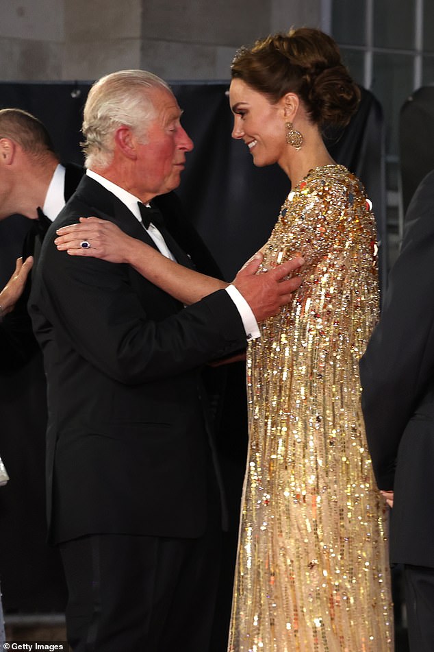 Kate and Charles hug at the premiere of No Time To Die at the Royal Albert Hall in London, in 2021