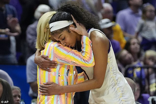 LSU head coach Kim Mulkey hugs forward Angel Reese late in the second half of a recent victory.