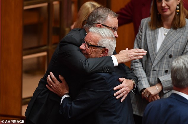 One of Anthony Albanese's closest friends in politics has blamed Labor's homeowner-friendly policies for Australia's housing crisis (the Labor leader is pictured in an April 2019 photo hugging former senator Doug Cameron).