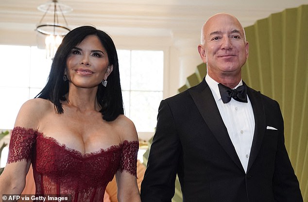 The 54-year-old wore a red Rasario lace and satin off-the-shoulder dress and corset that retails for $2,200 to the event.