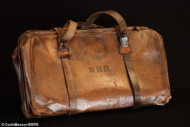A leather case that protected the violin played by the Titanic's bandleader when the ship sank is to sell for £120,000 at auction.