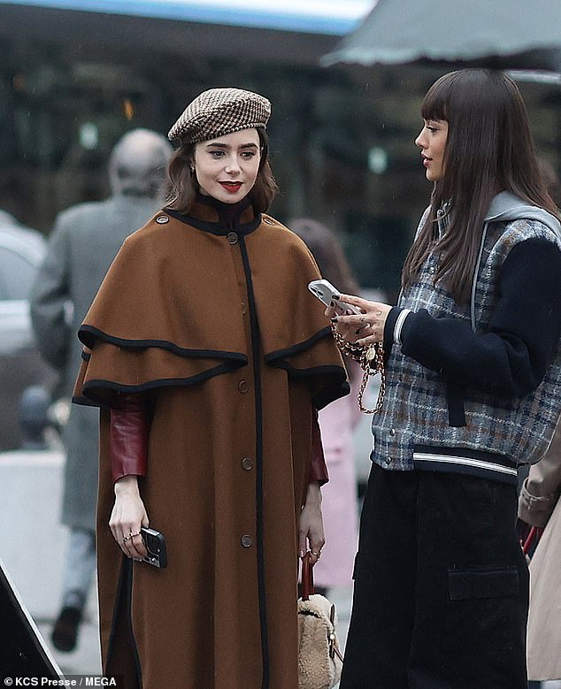 Lily Collins was accompanied by French first lady Brigitte Macron as she filmed the fourth season of Netflix hit Emily In Paris in the French capital on Tuesday.