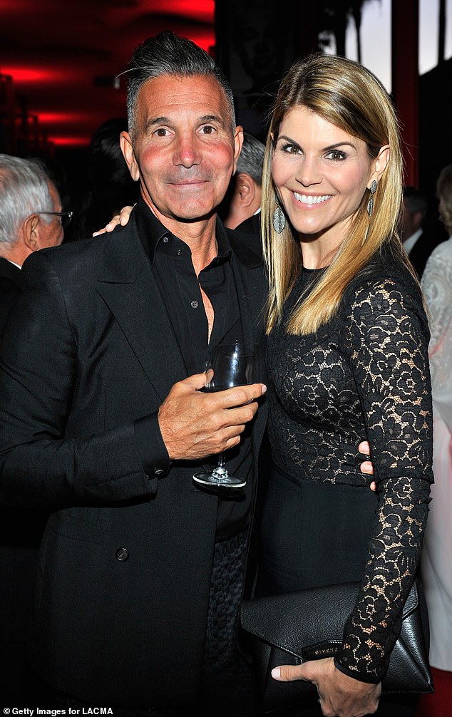 Loughlin says she was playing golf with her husband Mossimo Giannulli when she pulled out her phone and realized she had dozens of missed calls on the day of Saget's death; seen in 2015