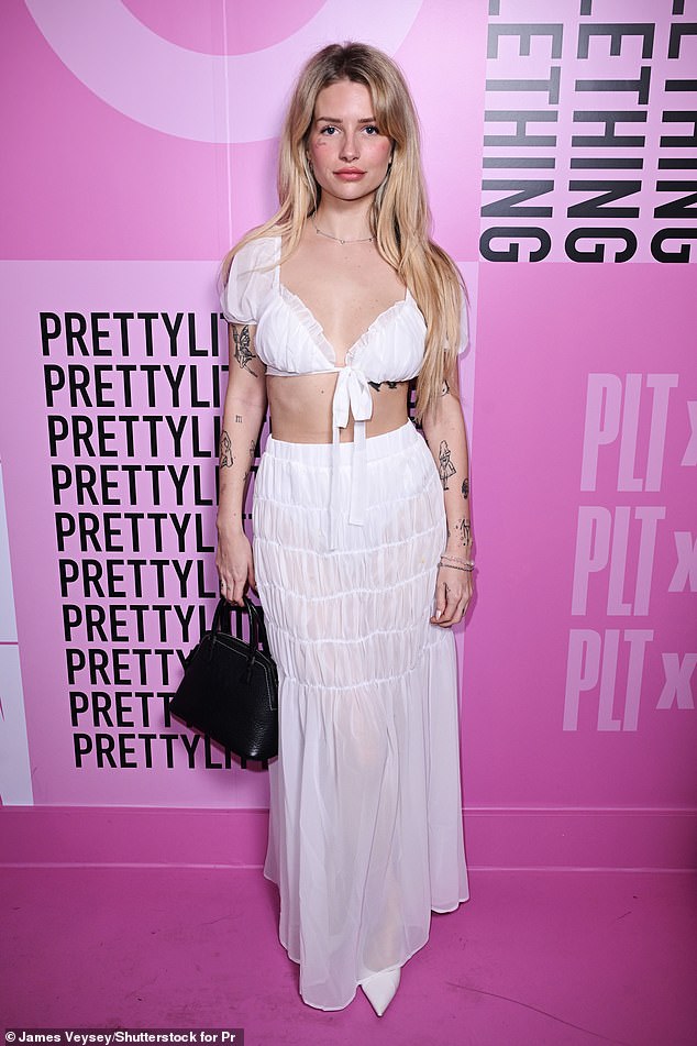 Lottie Moss, 26, showed off her toned stomach while celebrating the one-year anniversary of the PrettyLittleThing showroom in London on Thursday night.