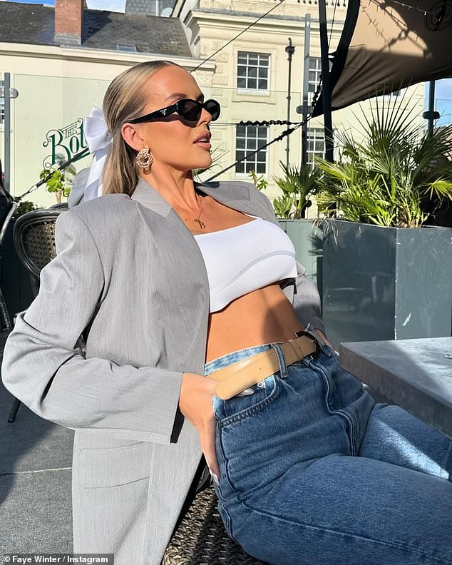 Faye Winter showed off her incredible figure in a white crop top while enjoying an outdoor lunch over the Easter holiday.