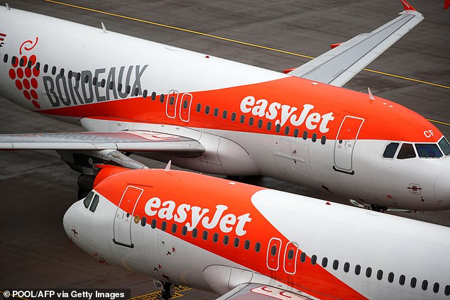 Turbulence: A post-pandemic boom has helped Easyjet cut first-half losses by £50m, but it lost between £340m and £360m in the six months to the end of March.