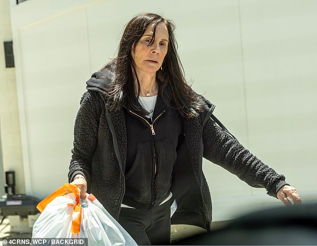 DailyMail.com spotted Marcia Clark, 70, taking out the trash outside her Los Angeles home on Thursday.
