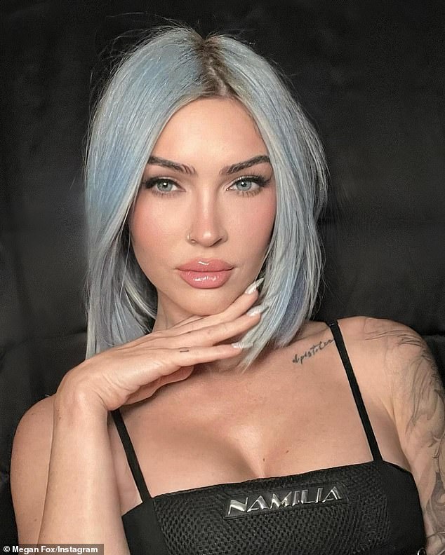 Megan Fox has a new hair color.  Machine Gun Kelly's on-again, off-again girlfriend debuted a new faded blue hair shade on Instagram on Tuesday.