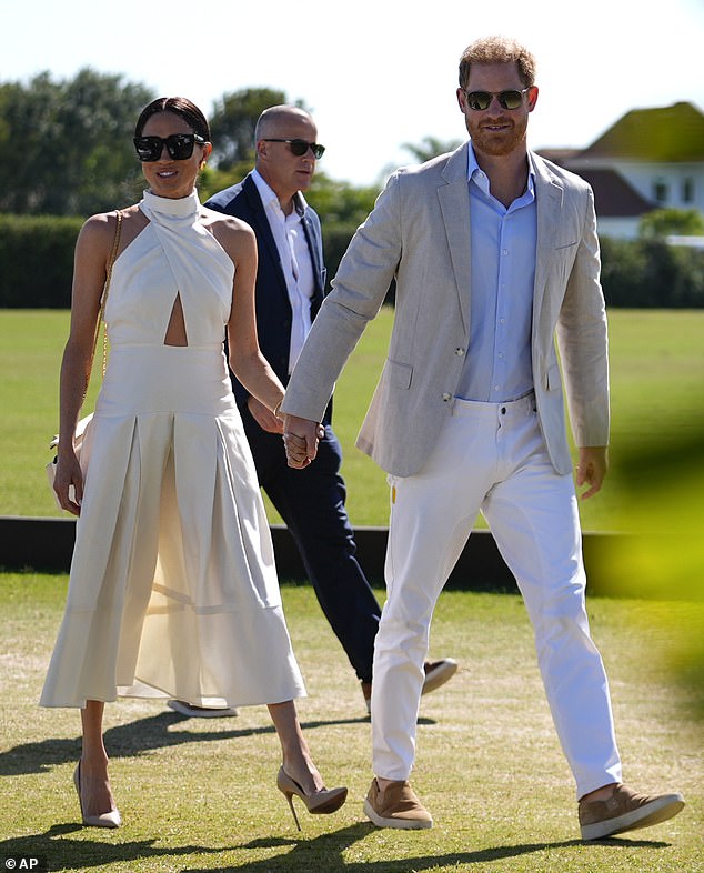 Prince Harry's wife, 42, donned the outfit at the Royal Salute Polo Challenge.  on Saturday, channeling the perfect, expensive casual look