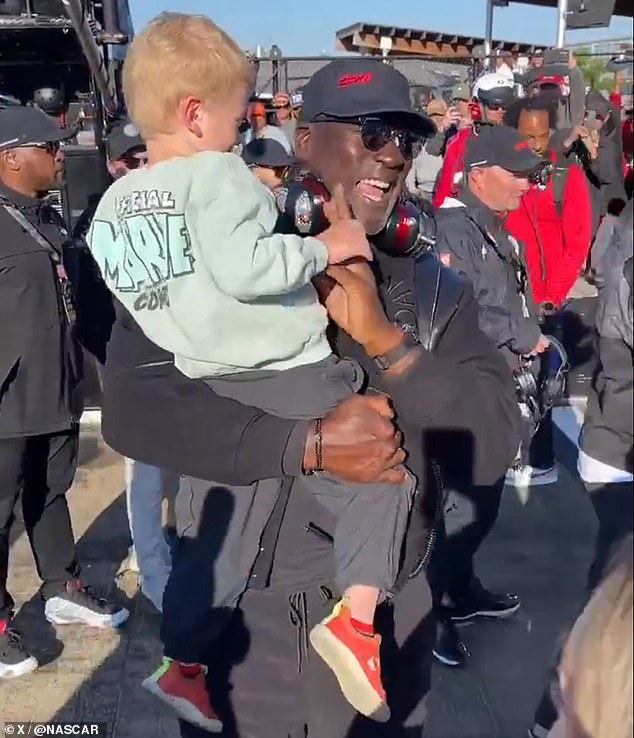 Michael Jordan celebrated 23XI Racing's victory at Talladega with the winning driver's son on Sunday