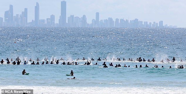 Hundreds of people (pictured) flocked to the Greenmount Beach Surf Club on the Gold Coast to celebrate the life of Ed Fanning.