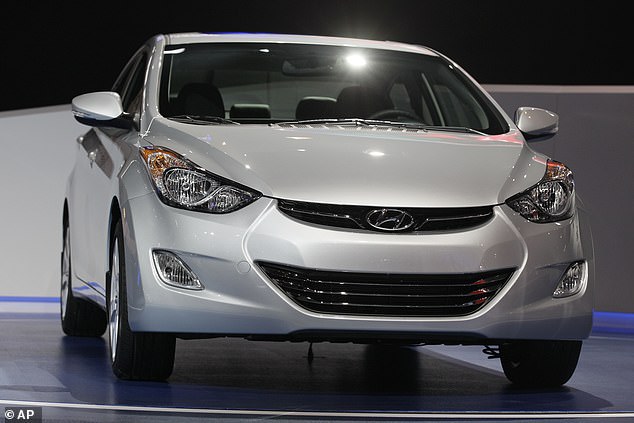 Millions of Hyundai and Kia models with alarming fire risks continue to circulate on American roads, despite having been removed from the market more than six months ago.  Pictured: a 2013 Hyundai Elantra Coupe