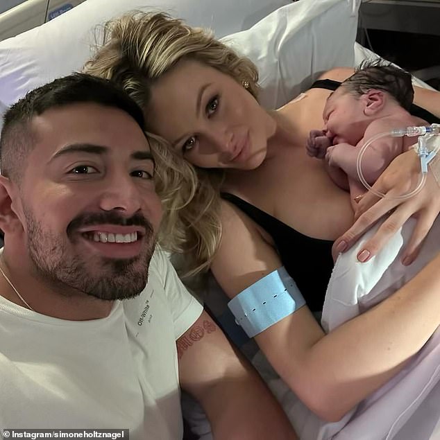 Simone announced last week that she had given birth on Easter Sunday. In a sweet photo, Simone holds her newborn daughter as she lies in a hospital bed while Jono (left) sits next to her.