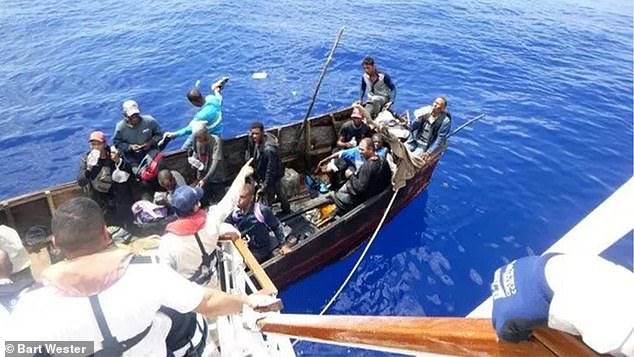 The group of migrants were offered food and medical care while the US Coast Guard was called to the Carnival Paradise cruise ship.