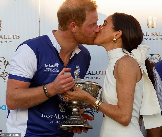 Moments before the awkward exchange, the pair enjoyed a passionate hug to celebrate Harry's victory in the Royal Salute Polo Challenge.