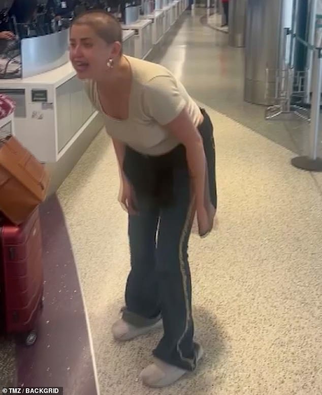 The unidentified woman was filmed verbally abusing airline staff at the counter after she allegedly missed her flight.
