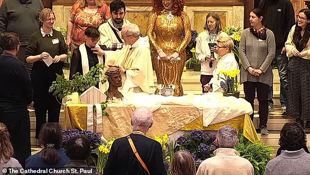 Bishop Alan Gates (in white chasuble) ripped the clerical collar from the neck of the Rev. Tamra Tucker after Tucker (to Gates' left) forgot the words of the church service.