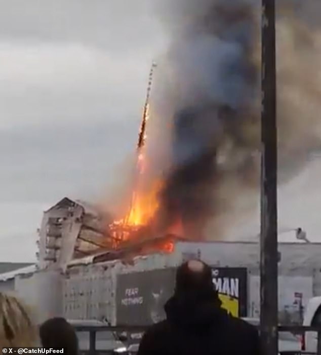 This is the devastating moment the historic spire of the Copenhagen Stock Exchange building collapses onto the street.