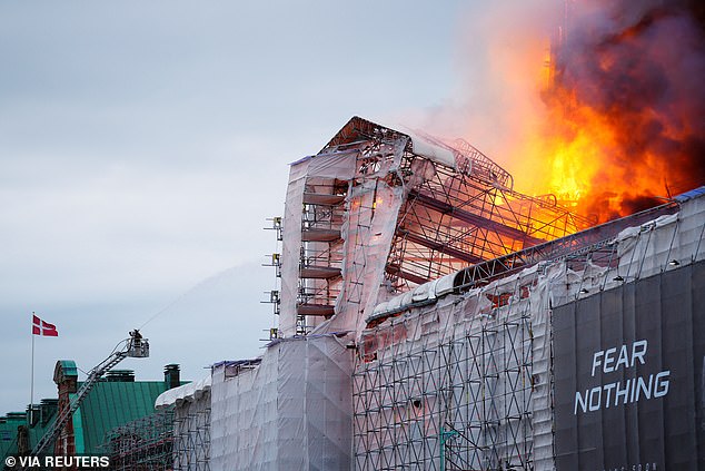 Denmark's historic stock exchange burst into flames after a fire broke out during renovations in Copenhagen today