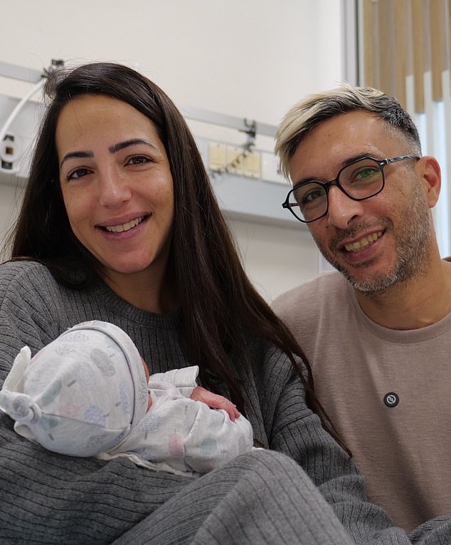Astar Moshe, 35 (left), pictured with his partner Shlomi Toby, 37, in hospital after the birth of their son Benaya Moshe.