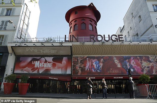 The blades of the famous windmill at the Moulin Rouge cabaret in Paris have fallen off