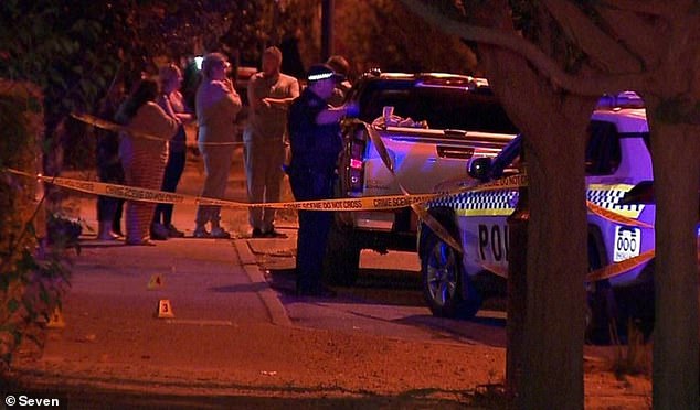 A man has been charged after a woman and her new partner were allegedly stabbed moments after arriving at her mother's house (pictured, crime scene on Friday).