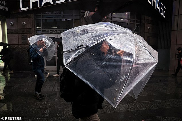 In the Big Apple, commuters struggled on their way home from work as high winds, thunder and lightning consumed the city.