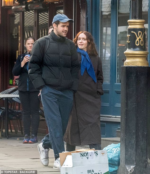 Olivia Cooke, 30, had a lively conversation with fellow actor Ralph Davis while they went for a brisk walk on Friday.