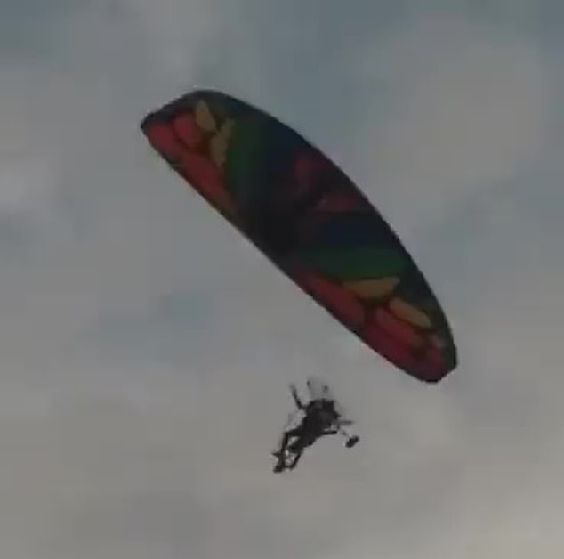 Hamas fighters bypassed Israel's border with the Gaza Strip by paragliding, according to the Israeli military (pictured: a paraglider crossing into Israel)