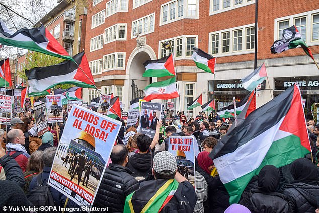 Pro-Palestinian protesters held banners and flags outside the Home Office in London on Friday.