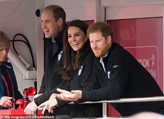 They were joined by Prince Harry as they cheered on the runners from the 'Heads Together' charity stand.