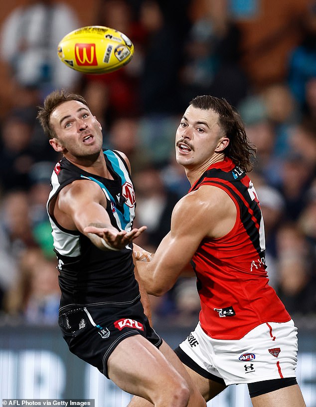 Scott O'Halloran blamed the AFL for not doing more to stamp out homophobia after Port Power star Jeremy Finlayson (left) hit an Essendon player with an anti-gay slur on Friday night.