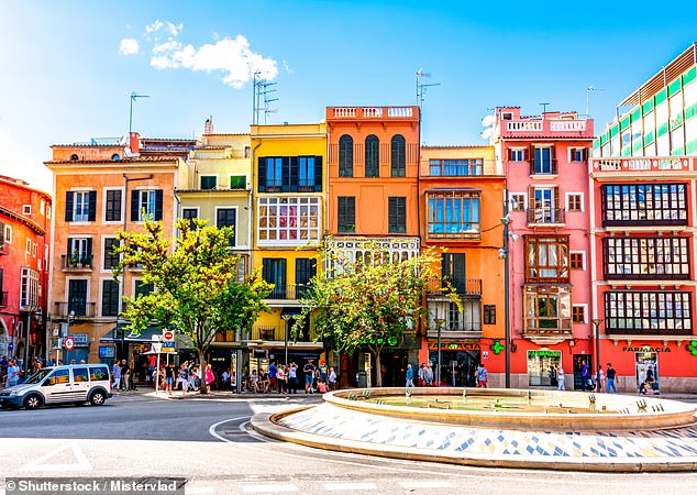Palma can be explored on foot or by bicycle.  Above, colorful houses line the city streets.