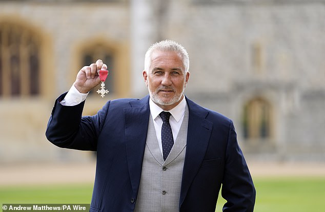 Famed baker Paul Hollywood was awarded an MBE at Windsor Castle for services to baking and broadcasting on Wednesday.