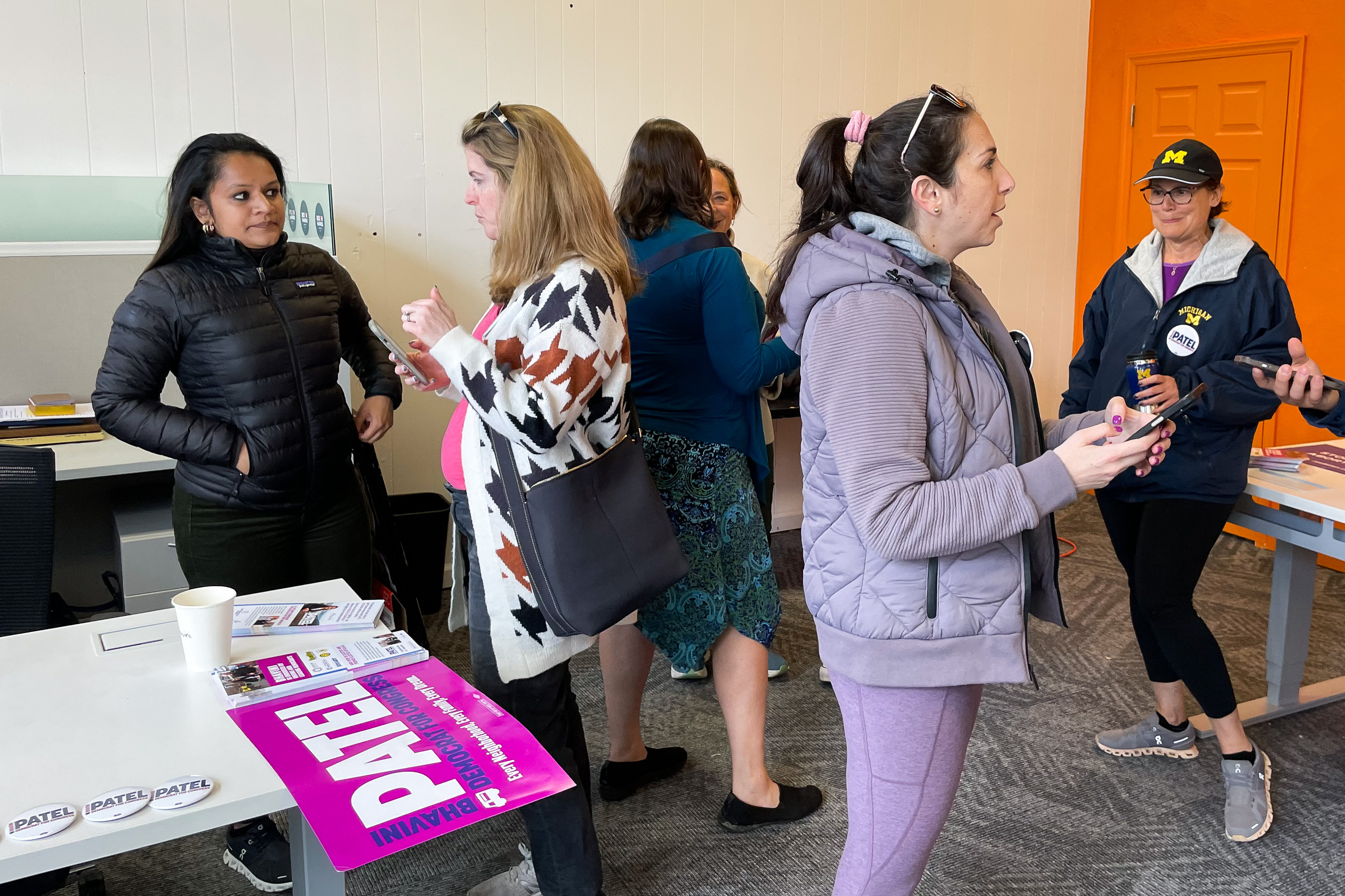 Bhavini Patel (left) talks to canvassers at her campaign headquarters in Pittsburgh's Squirrel Hill neighborhood on April 13.