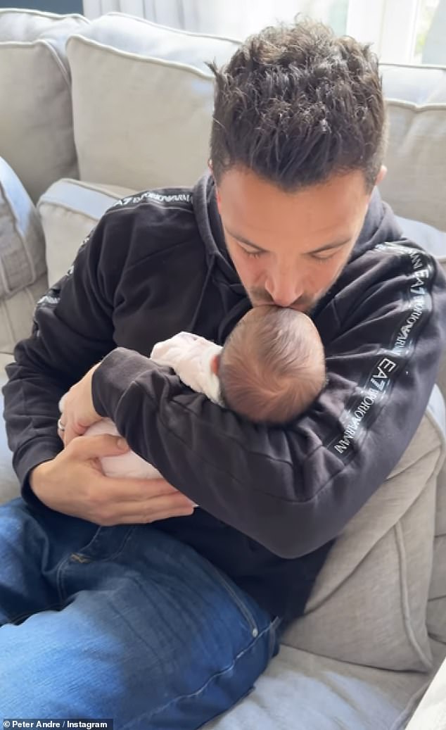 Peter Andre sweetly kissed his newborn daughter on the head in an adorable update on Wednesday.